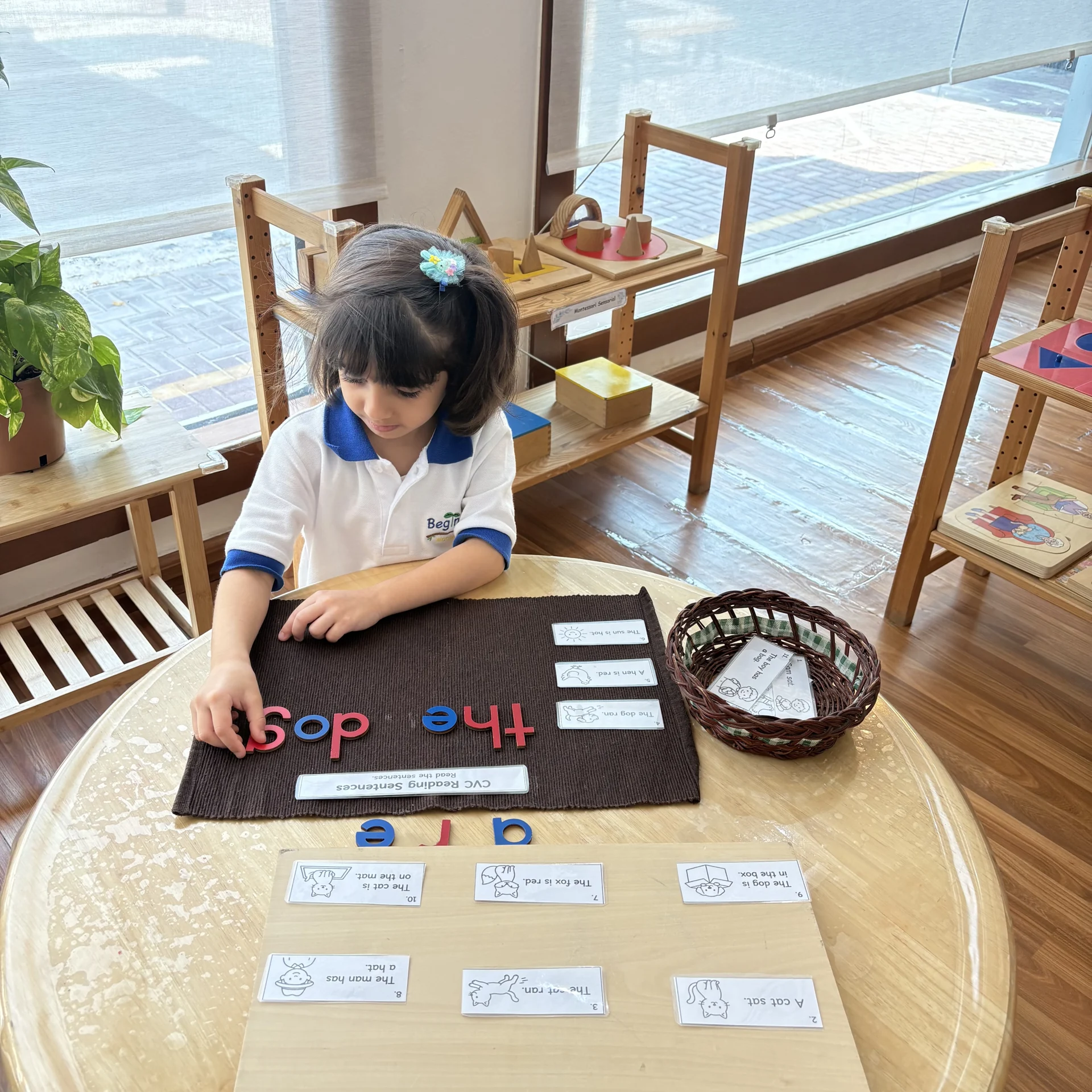 Child working with movable alphabet letters.