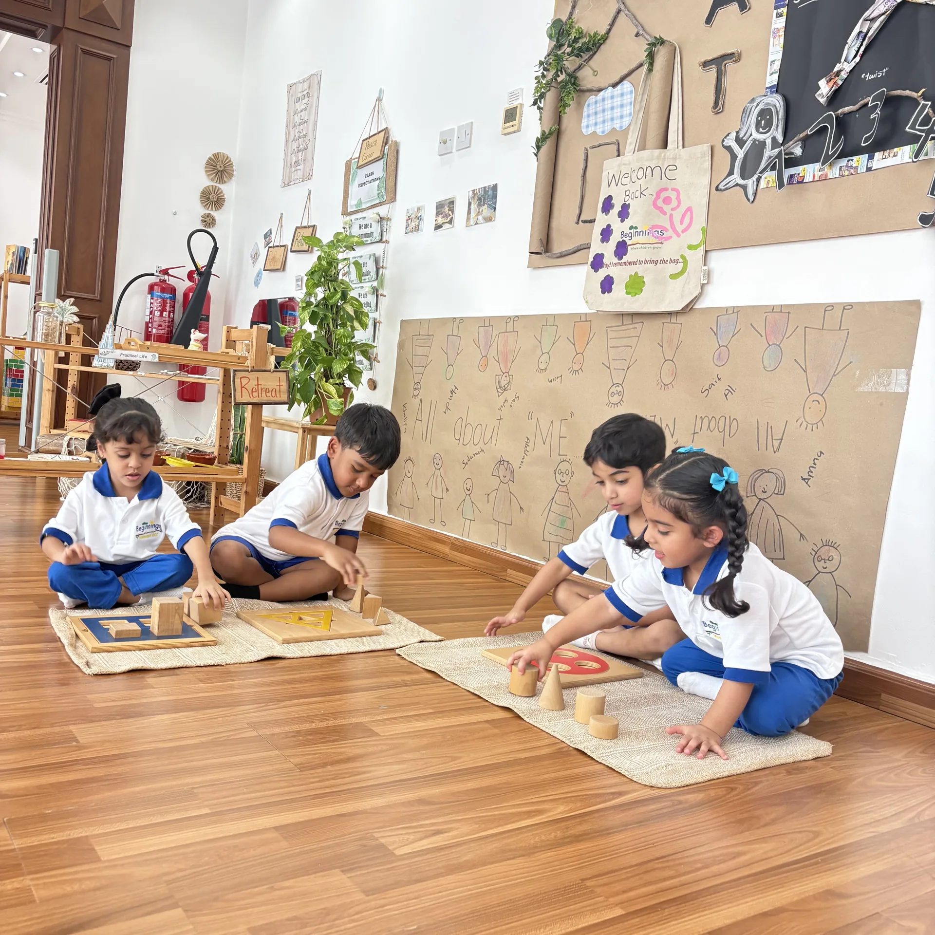 Sensorial materials and shared floor work at Beginnings Forest Montessori in Muhaisnah, Dubai.