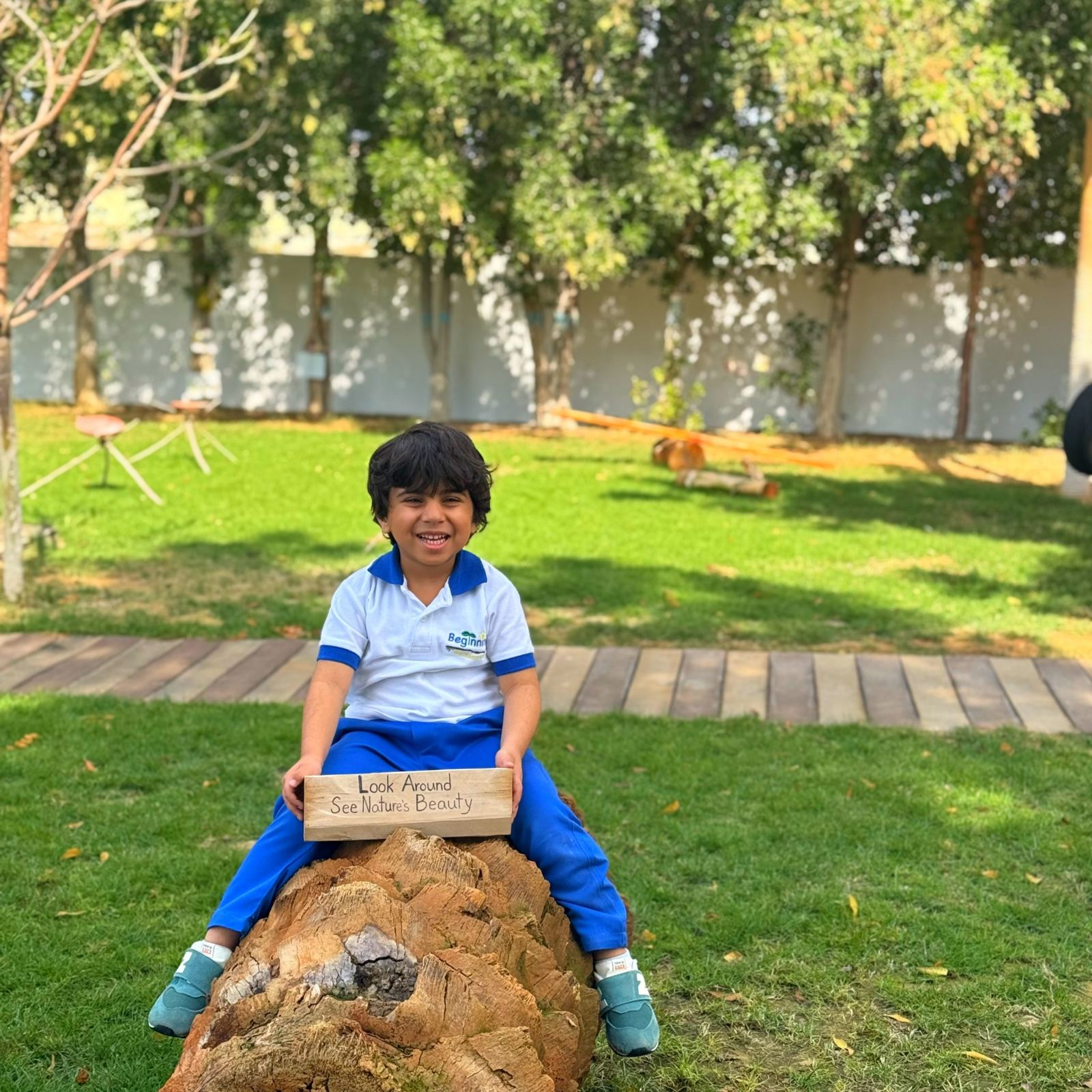 Child engaging with nature at Beginnings Forest Montessori Dubai
